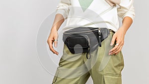 Black Genuine Leather Belt Bag on a Woman photo