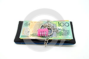 Black leather wallet with lock and some banknote