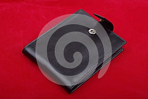 Black leather wallet on red background money purse finance shopping currency object business wealth cash single pay rich personal