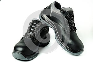 Black leather work safety boots isolated on white