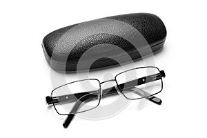 Black leatherette eyeglass case and eyeglasses in fine metal frame photo