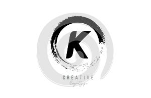 Black letter grunge circle K alphabet letter logo icon design template for company business
