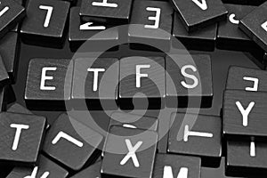 Black letter tiles spelling the word & x22;ETFs& x22;