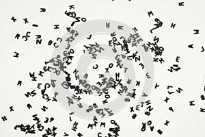 Black letters of the alphabet on the canvass surface