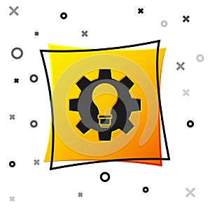 Black Light bulb and gear icon isolated on white background. Innovation concept. Business idea. Yellow square button