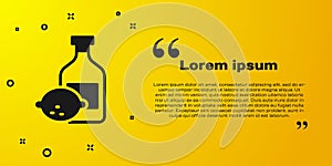 Black Limoncello bottle icon isolated on yellow background. Bottle of fresh homemade lemonade. Vector