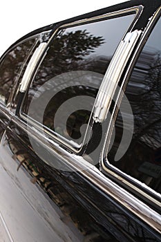 Black limousine car with mirror glass.