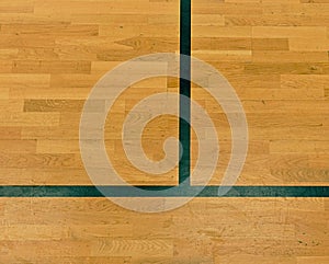 Black lines in hall playground. Worn out wooden floor of sports hall with lines