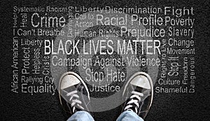 Black Lives Matter Word Cloud on Asphalt Concept of Fighting Racism