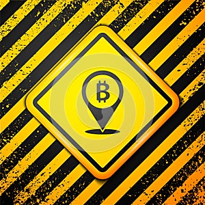 Black Location bitcoin icon isolated on yellow background. Physical bit coin. Blockchain based secure crypto currency