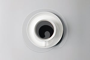 Black lungo in white cup and plate