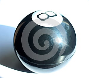 Black magic ball with the number eight on a white background