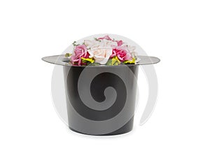 Black magic hat with flowers isolated on a white background
