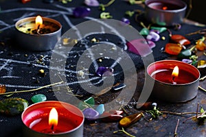 Black magic ritual background with magical altar, candles, crystals and herbs. Sorcerer rite of witchcraft and occultism