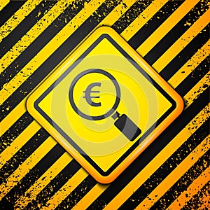 Black Magnifying glass and euro symbol icon isolated on yellow background. Find money. Looking for money. Warning sign