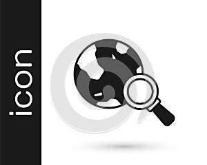 Black Magnifying glass with globe icon isolated on white background. Analyzing the world. Global search sign. Vector