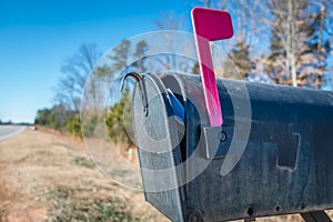 Black mail box and post office mail with blue sky