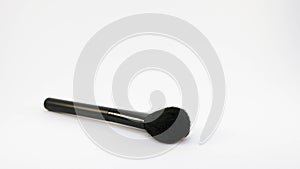Black makeup brush isolated on white background