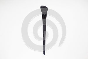 Black makeup brush isolated on white background