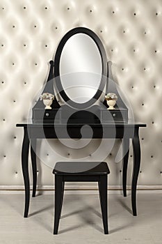 Black makeup mirror vanity with leather wall