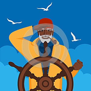 Black male fisherman looks into distance standing at helm of boat
