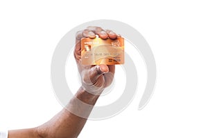 Black male hand holding plastic card