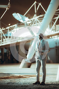 Black man against urban background