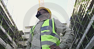 Black man, architect and inspection on construction site for building, industrial architecture or management. African