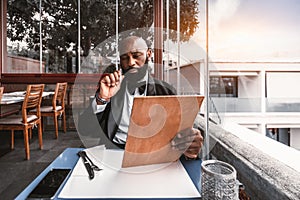 Black man on a bar with side view