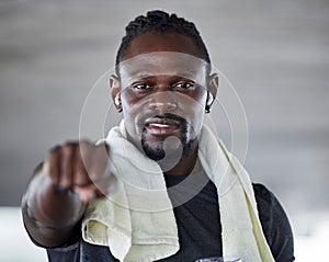 Black man, boxing and fist with fitness portrait, sports and martial arts with exercise and earphones for music. Athlete