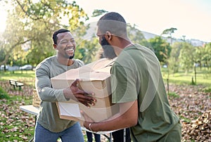 Black man, charity and holding box in park of donation, community service or social responsibility. Happy guy, NGO