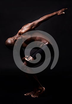 Black man, dancer and fitness with muscular body for energy, style or art on a dark studio background. African male