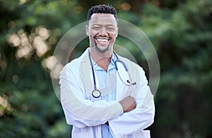 Black man, doctor portrait and arms crossed of healthcare and wellness professional outdoor. Success, motivation and