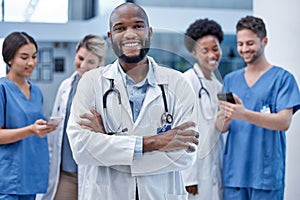 Black man, doctor and portrait with arms crossed in hospital, clinic and surgery of leadership. Happy medical worker