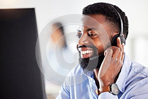 Black man, face and headset, callcenter and contact us with customer service agent in workplace with smile. CRM, phone