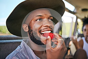 Black man, face or watermelon summer fruit on safari game drive, sustainability nature or environment landscape travel