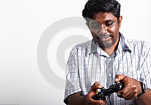 Black man funny use hand playing video game pad joystick