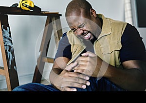 A black man getting injured in a house