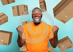 Black man is happy to receive a lot of packages photo