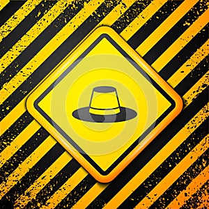 Black Man hat with ribbon icon isolated on yellow background. Warning sign. Vector