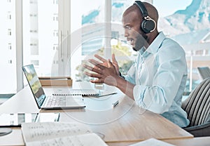 Black man, headphones and virtual call on laptop in office, webinar meeting and video conference. Person, talking and