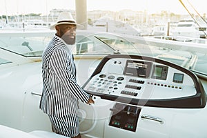 A black man on his luxury his yacht