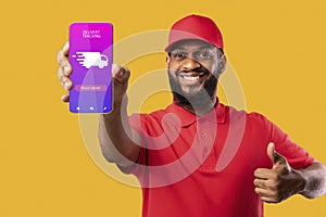 Black man holding cellphone with delivery tracking app