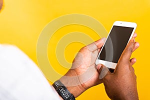 Black man holding digital mobile smartphone blank screen space on hands