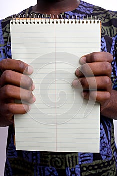 Black man holding writing tablet