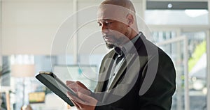 Black man in office with tablet, email or social media review for tech business, schedule or agenda. Internet, digital