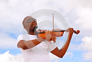 Black man playing violin