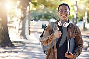 Black man, portrait or thumbs up on campus, park nature or garden in college review, university like or school vote