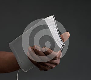 black man praying to god Caribbean man praying with bible background stock photo