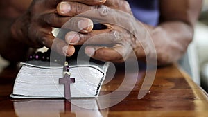 black man praying to god Caribbean man praying with black background stock footage